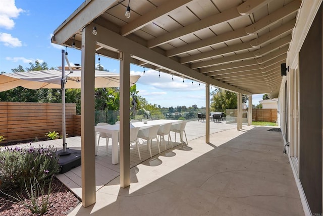 view of patio / terrace featuring outdoor dining area and a fenced backyard