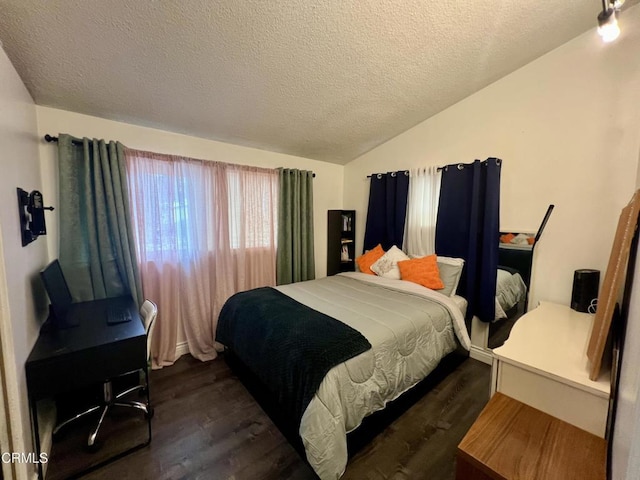 16041 Jersey St, Granada Hills, CA 91344 - bedroom with vaulted ceiling, a textured ceiling, and dark wood-type flooring