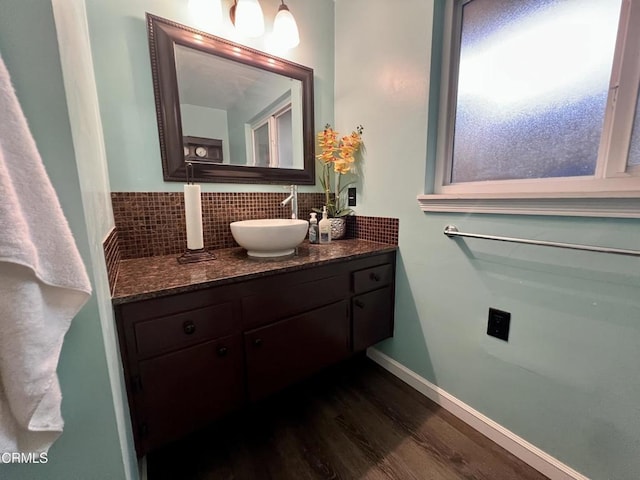 16041 Jersey St, Granada Hills, CA 91344 - bathroom with baseboards, decorative backsplash, wood finished floors, and vanity
