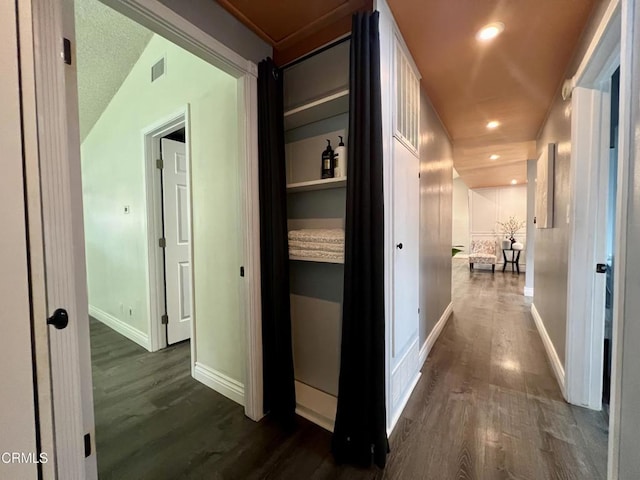 16041 Jersey St, Granada Hills, CA 91344 - hall with baseboards, dark wood-style flooring, and visible vents