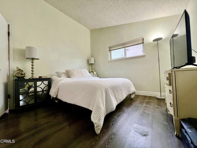 16041 Jersey St, Granada Hills, CA 91344 - bedroom featuring dark wood-type flooring, a textured ceiling, and baseboards