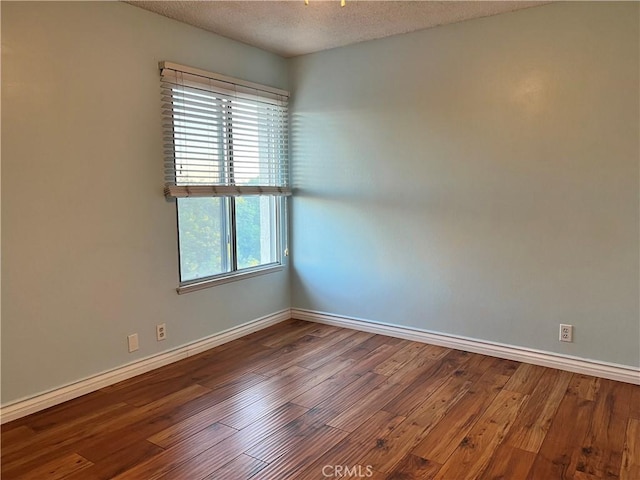 4535 Ramona Ave Unit 14, La Verne, CA 91750 - spare room with wood finished floors, a textured ceiling, and baseboards
