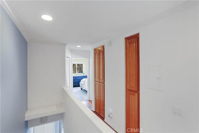 corridor with recessed lighting and ornamental molding