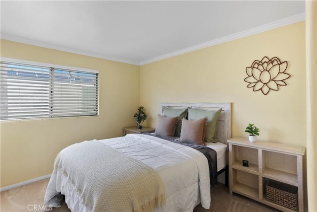 carpeted bedroom with baseboards and ornamental molding