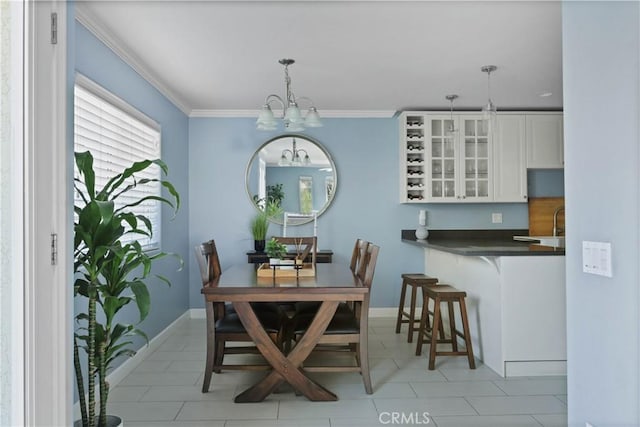 4069 Lamont St Unit 1, San Diego, CA 92109 - dining area with baseboards, a notable chandelier, ornamental molding, and light tile patterned floors