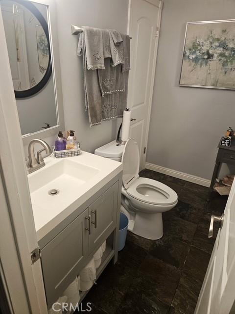 bathroom with vanity and toilet