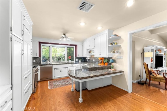 1215 Mira Monte Dr, Redlands, CA 92373 - kitchen with dishwasher, white microwave, a sink, light wood-type flooring, and recessed lighting