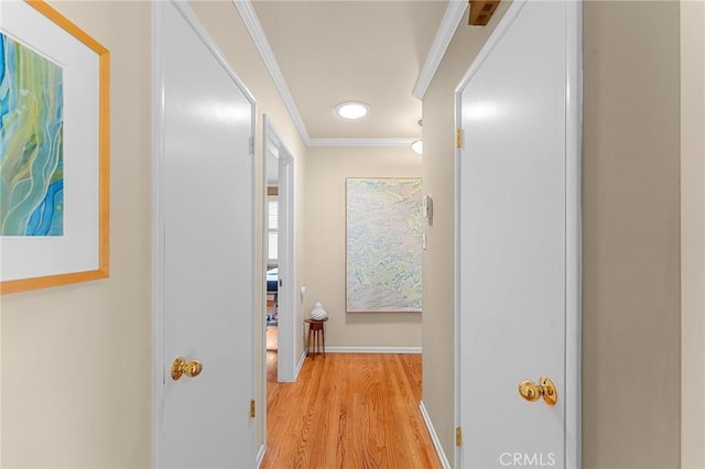 1215 Mira Monte Dr, Redlands, CA 92373 - hallway featuring light wood finished floors, ornamental molding, and baseboards