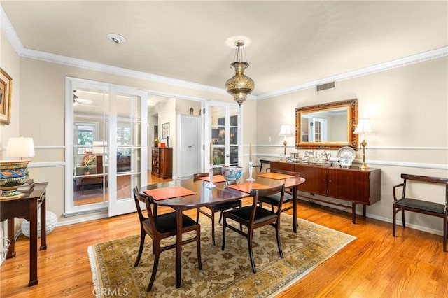 1215 Mira Monte Dr, Redlands, CA 92373 - dining space featuring crown molding, light wood-style flooring, and baseboards