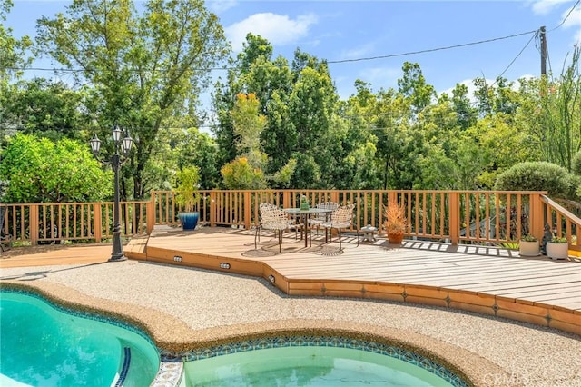1215 Mira Monte Dr, Redlands, CA 92373 - view of pool featuring a deck, outdoor dining space, and an in-ground hot tub