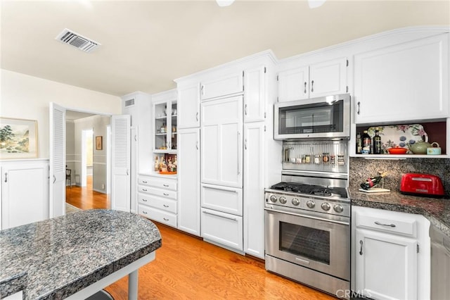1215 Mira Monte Dr, Redlands, CA 92373 - kitchen with appliances with stainless steel finishes, light wood-style flooring, white cabinetry, and open shelves
