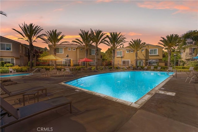 27441 Charleston Ct Unit 3, Murrieta, CA 92562 - pool at dusk with a community pool, fence, and a patio area