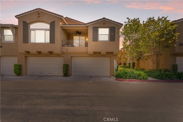 27441 Charleston Ct Unit 3, Murrieta, CA 92562 - view of property featuring a garage, stucco siding, a balcony, and a tile roof