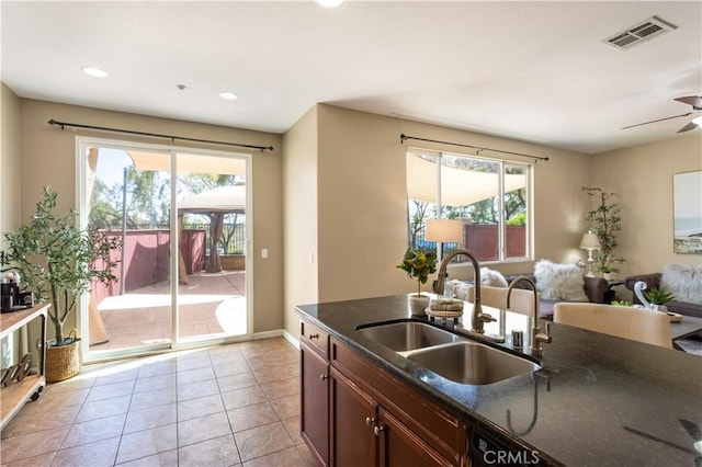 27441 Charleston Ct Unit 3, Murrieta, CA 92562 - kitchen with visible vents, a sink, a ceiling fan, and a wealth of natural light