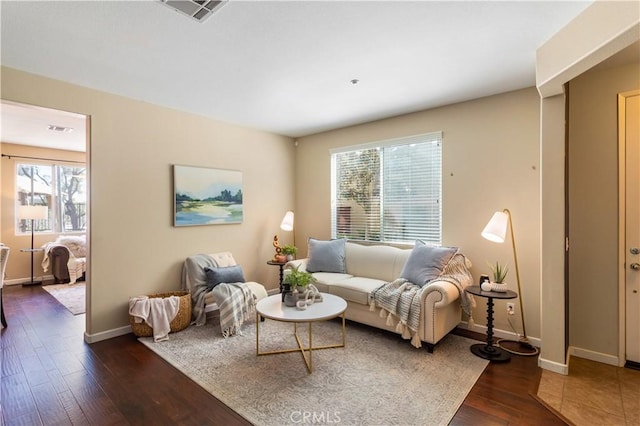 27441 Charleston Ct Unit 3, Murrieta, CA 92562 - living room with baseboards, visible vents, a wealth of natural light, and dark wood finished floors