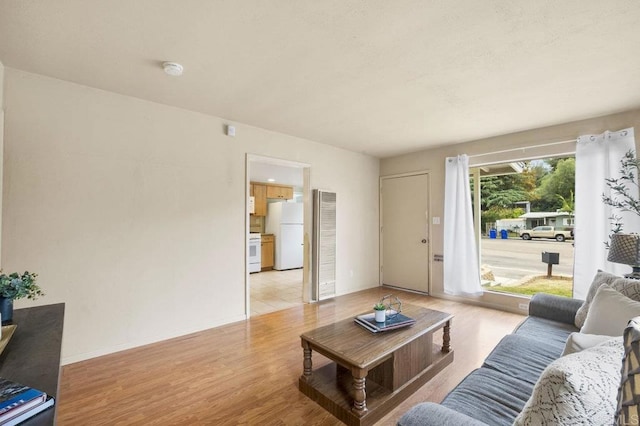 5566 Streamview Dr, San Diego, CA 92105 - living room with light wood-style floors and baseboards