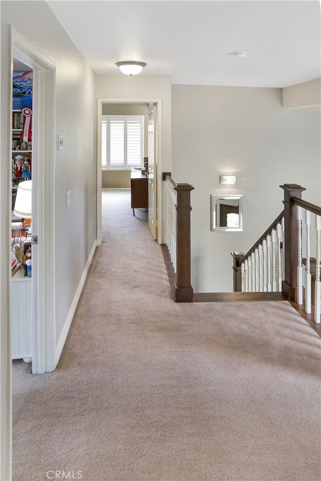 11818 Mount Harvard Ct, Rancho Cucamonga, CA 91737 - hallway with an upstairs landing, light colored carpet, and baseboards