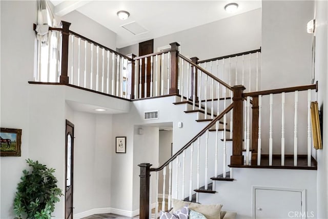 11818 Mount Harvard Ct, Rancho Cucamonga, CA 91737 - staircase with a towering ceiling and baseboards