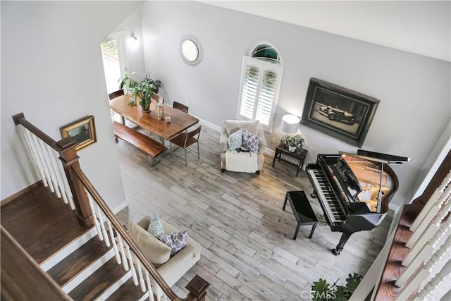 11818 Mount Harvard Ct, Rancho Cucamonga, CA 91737 - living room featuring wood finished floors, baseboards, and stairs