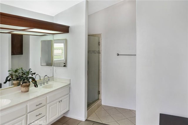 11818 Mount Harvard Ct, Rancho Cucamonga, CA 91737 - bathroom featuring a stall shower, tile patterned floors, double vanity, and baseboards
