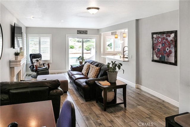11818 Mount Harvard Ct, Rancho Cucamonga, CA 91737 - living room featuring baseboards and wood finished floors