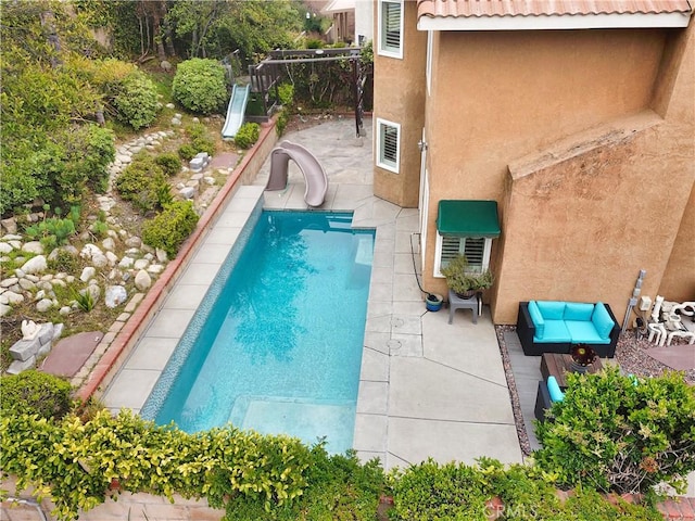 11818 Mount Harvard Ct, Rancho Cucamonga, CA 91737 - view of swimming pool with a water slide, a patio area, and fence