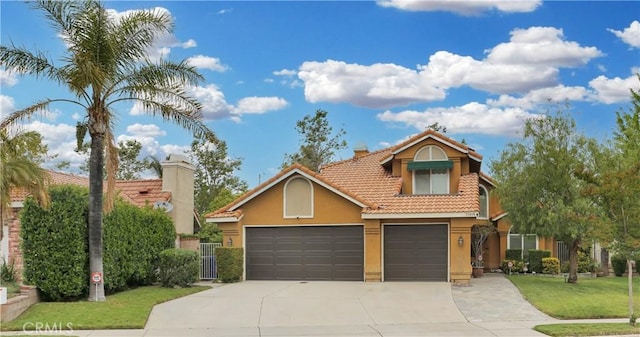 11818 Mount Harvard Ct, Rancho Cucamonga, CA 91737 - view of front of home with stucco siding, concrete driveway, a tile roof, a front lawn, and a garage