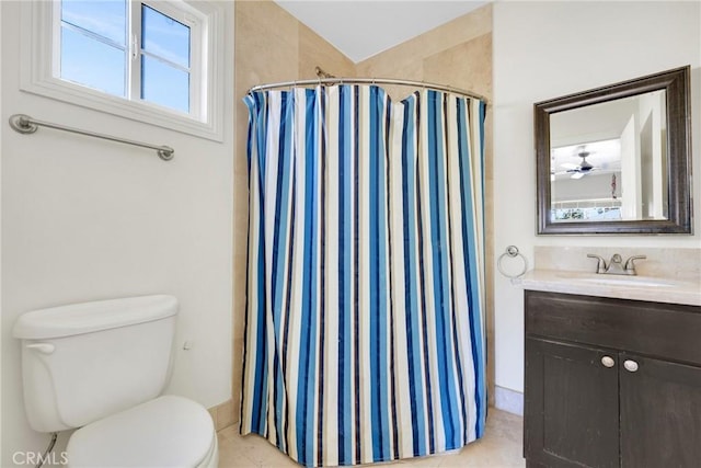 bathroom with tile patterned flooring, a shower with curtain, toilet, and vanity