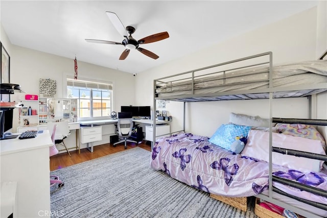 bedroom with ceiling fan and wood finished floors