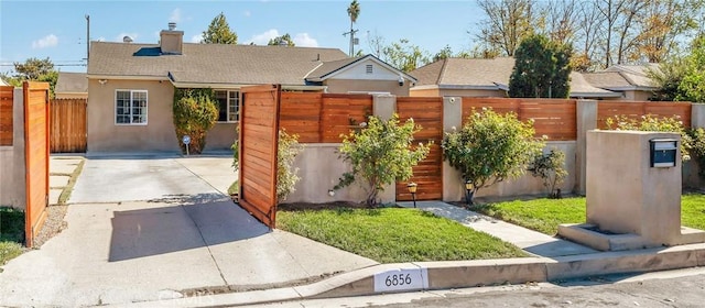 view of front of house with fence, roof with shingles, stucco siding, a chimney, and concrete driveway