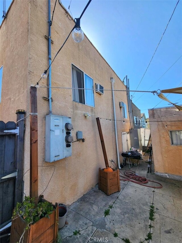 2043 City View Ave, Los Angeles, CA 90033 - view of side of property featuring stucco siding and a patio area