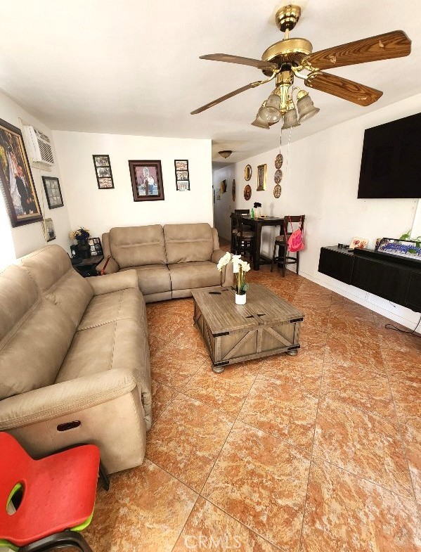 2043 City View Ave, Los Angeles, CA 90033 - tiled living room featuring ceiling fan