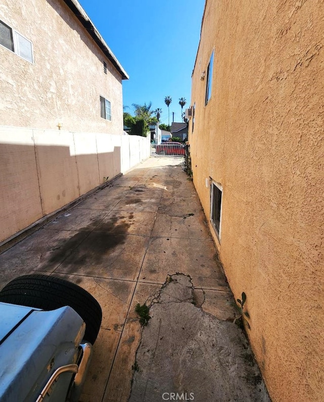 2043 City View Ave, Los Angeles, CA 90033 - view of side of property with stucco siding, fence, and a patio area