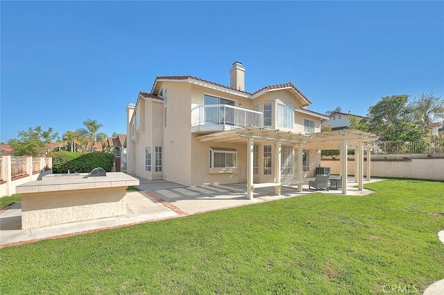 17527 Mondino Dr, Rowland Heights, CA 91748 - back of property with a balcony, stucco siding, a chimney, a pergola, and a patio