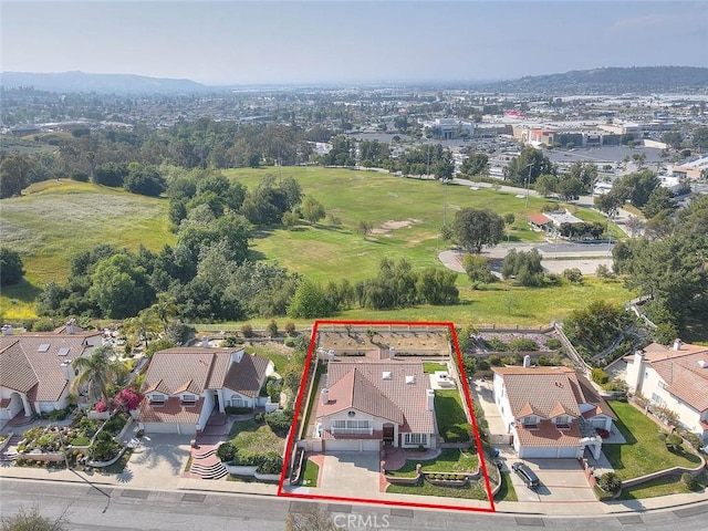 17527 Mondino Dr, Rowland Heights, CA 91748 - aerial view of residential area with property boundaries highlighted and a mountain backdrop