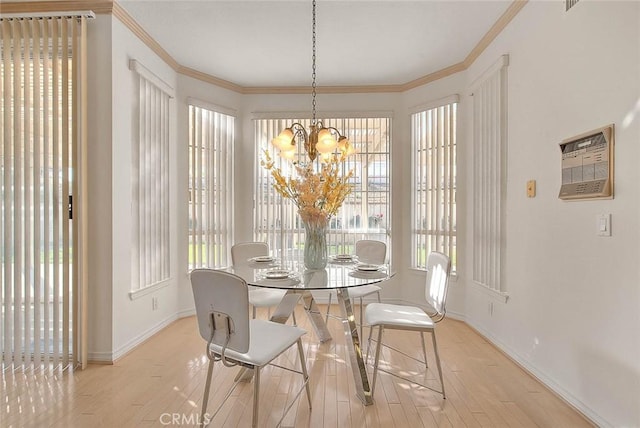 17527 Mondino Dr, Rowland Heights, CA 91748 - dining area with baseboards, hardwood / wood-style floors, crown molding, and a chandelier