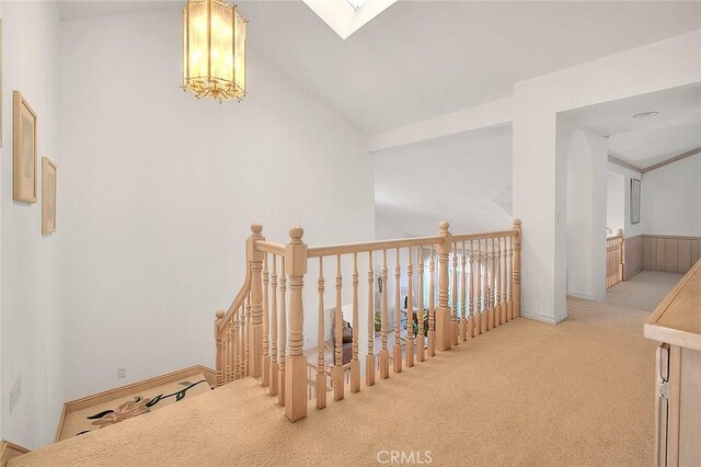 17527 Mondino Dr, Rowland Heights, CA 91748 - hall with an upstairs landing, carpet flooring, baseboards, high vaulted ceiling, and a skylight