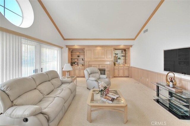 17527 Mondino Dr, Rowland Heights, CA 91748 - living room with wainscoting, high vaulted ceiling, ornamental molding, carpet, and a glass covered fireplace