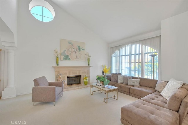 17527 Mondino Dr, Rowland Heights, CA 91748 - carpeted living area featuring decorative columns, high vaulted ceiling, healthy amount of natural light, and a tiled fireplace