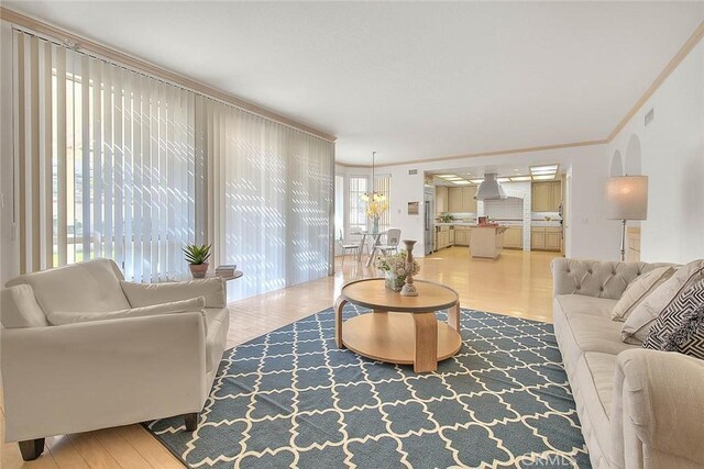 17527 Mondino Dr, Rowland Heights, CA 91748 - living area featuring crown molding and wood finished floors