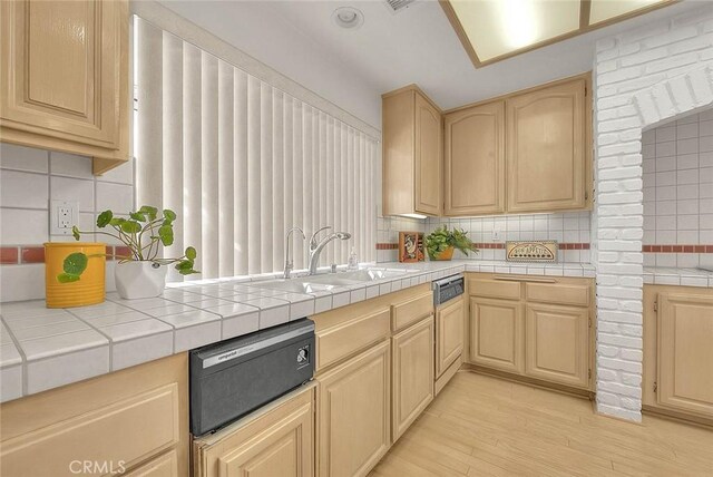 17527 Mondino Dr, Rowland Heights, CA 91748 - kitchen featuring a sink, backsplash, light brown cabinetry, and light wood-style flooring