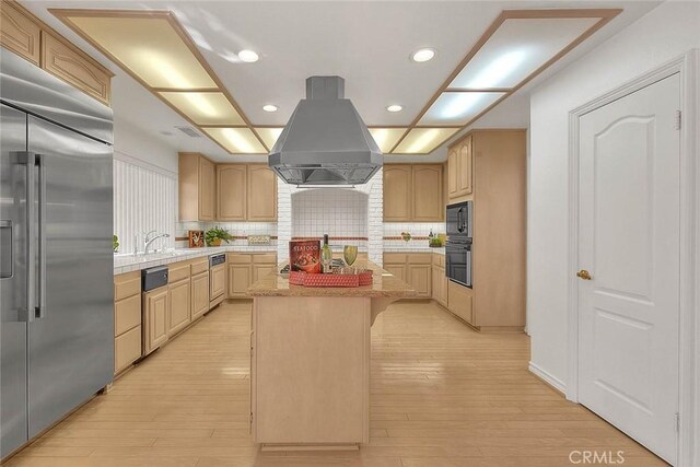 17527 Mondino Dr, Rowland Heights, CA 91748 - kitchen with black appliances, island range hood, light countertops, light brown cabinets, and recessed lighting