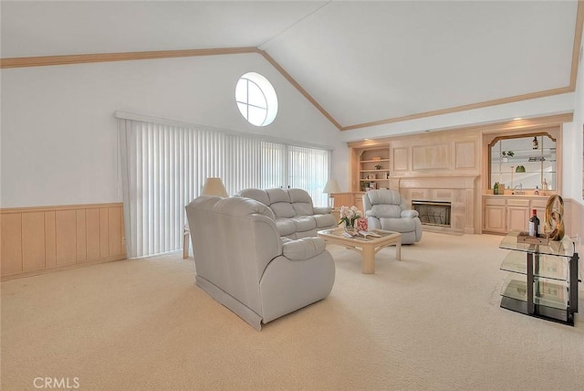 17527 Mondino Dr, Rowland Heights, CA 91748 - living room featuring carpet floors, built in shelves, high vaulted ceiling, a glass covered fireplace, and crown molding