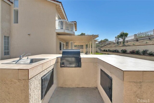 17527 Mondino Dr, Rowland Heights, CA 91748 - view of patio featuring a balcony, a grill, exterior kitchen, a sink, and fence