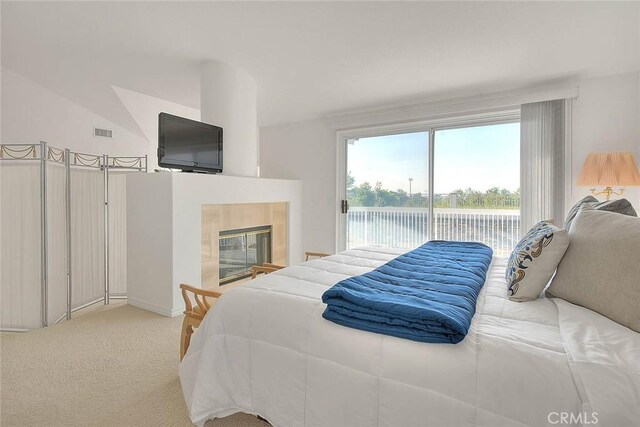 17527 Mondino Dr, Rowland Heights, CA 91748 - bedroom featuring access to outside, light colored carpet, and a fireplace