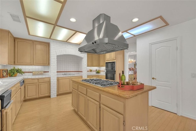 17527 Mondino Dr, Rowland Heights, CA 91748 - kitchen with stainless steel gas stovetop, island range hood, light brown cabinets, light countertops, and recessed lighting
