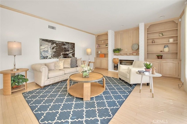 17527 Mondino Dr, Rowland Heights, CA 91748 - living room with wood finished floors, crown molding, built in shelves, and baseboards