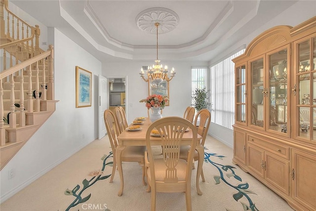 17527 Mondino Dr, Rowland Heights, CA 91748 - dining room with a raised ceiling, light colored carpet, a chandelier, and baseboards