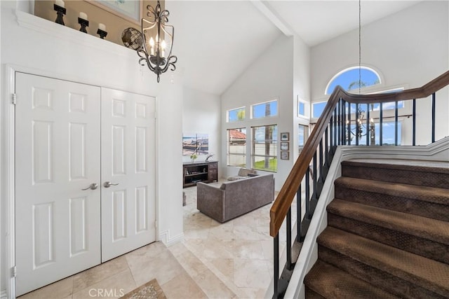 1081 Vista Lomas Ln, Corona, CA 92882 - stairs featuring a chandelier, marble finish floor, and high vaulted ceiling