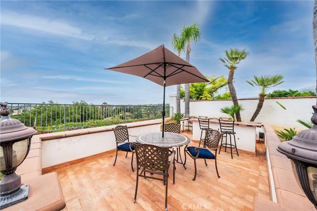 1081 Vista Lomas Ln, Corona, CA 92882 - view of patio with a fenced backyard, outdoor dry bar, and outdoor dining space